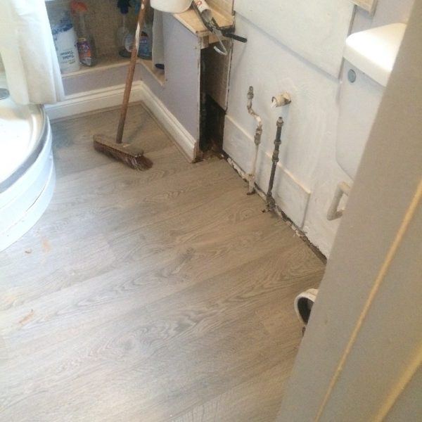 Shower room with new laminate flooring installed