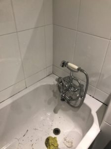 Bathtub with silicon around it removed