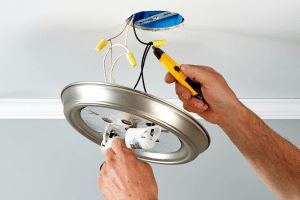 Picture of a light fixture being fixed or installed