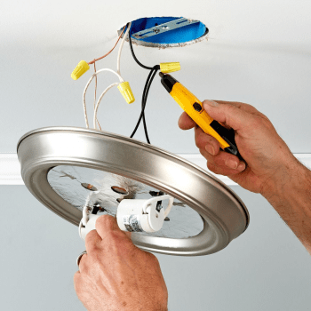Picture of a light fixture being fixed or installed