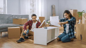 Picture of a couple trying to assemble ikea furniture
