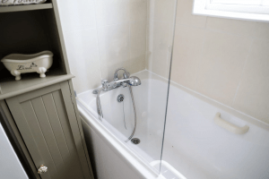 Image of a bathroom with bathtub and cabine
