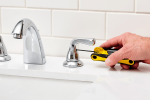 Picture of sink tap getting fixed