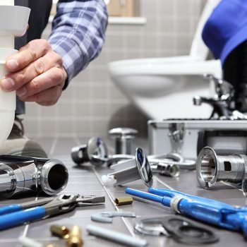 Plumber installing a sink trap
