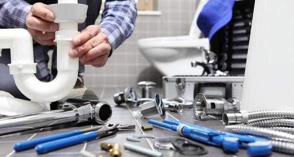 Plumber installing a sink trap