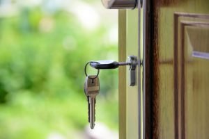 Image of a door with key in the lock