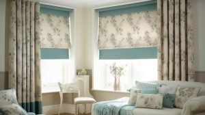 Room with stylish blinds and curtains installed, blind fitter